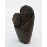 A carved Nigerian soapstone image of 2 figures in an embrace 4" high  CONDITION: Please Note -  we