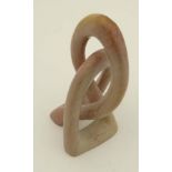 Vintage Retro : an abstract rouge soapstone interwoven sculpture. 8 7/8" high.
 CONDITION: Please