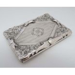 A silver card case with engraved acanthus and engine turned decoration. Hallmarked Birmingham 1904