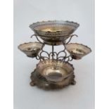 A late 19thC / early 20thC silver plate table centrepiece the circular stand  with acanthus and C-