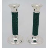 A pair of late 20thC silver plate candlesticks with green shagreen covered column. Approx 7" high