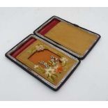 Edwardian leather card case with embroidered kid and silk lined interior  having compartment etc.