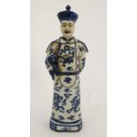 A blue and white Chinese figurine of Qing dynasty Emperor Yong Zheng  Marked to base. 18'' High.