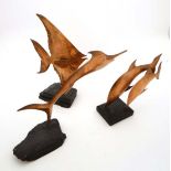 Vintage Retro : a mid 20 th century collection of three embossed copper on slate fish sculptures ,