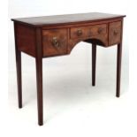 A late 19thC mahogany bow front writing table / desk with one frieze drawer and 2 deep drawers