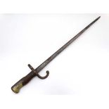 Militaria : A mid 19thC French M1874 Bayonet , the blade stamped with makers marks 'Mre d'Armes de