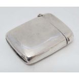 A silver vesta case with hinged lid and striker under . Hallmarked Birmingham 1901 maker