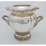 A late 20thC silver plate wine cooler / champagne bucket with twin handles and removable liner.