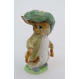 A Beswick Beatrix Potter figure of '' Benjamin Bunny '' with gold oval back stamp. 4'' high