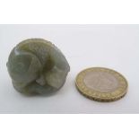 A carved jadeite oriental figure of a fish upon a lily pad 1 1/4" wide  CONDITION: Please Note -  we