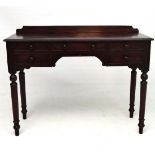 A 19thC mahogany writing desk having single long drawer flanked by two graduated short drawers on