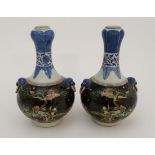A Pair of Chinese garlic head shaped vases. The top painted in blue on a white ground with lotus