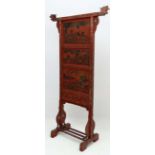 A tall Oriental screen with three panel decoration, blind fret and gilt carving to centre panel. the