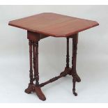 A small 19thC walnut Sutherland table with turned legs and twin pillar supports and canted