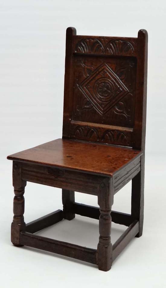 A 17thC carved oak solid seat single chair with panel back . 33" high x 17 3/4" wide x 15" deep - Image 2 of 4