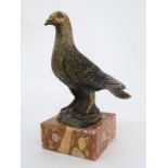 Cold painted metal figure of a Racing pigeon on a rouge flecked squared marble base , 9 1/2"