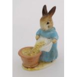 A Beswick Beatrix Potter figure of '' Mrs Cecily Parsley '' with gold oval back stamp. 4 1/4''