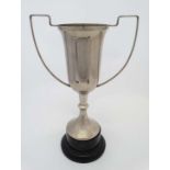 A silver plate twin handled pedestal trophy cup with socle base 17" high  CONDITION: Please