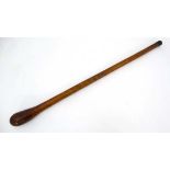 A late 19thC hardwood knobkerrie , the one piece formed as carved root ball and shaft with iron