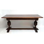 Bevin Funnel : An early - mid 20thC oak refectory table with cup and cover carved pedestals to