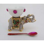 A 21stC enamelled and be-jwelled table salt in the form of a dish atop an elephant with an enamelled