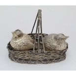 A 20thC silver plate novelty cruet set, the salt and pepper formed as birds, the stand formed as a