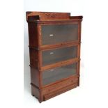 The Globe Wernicke Co.Ltd: An early 20thC serpentine shaped oak 4 sectional bookcase ( 3 glass