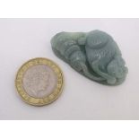 A carved jadeite depiction of a monkey with gourds 2" long  CONDITION: Please Note -  we do not make