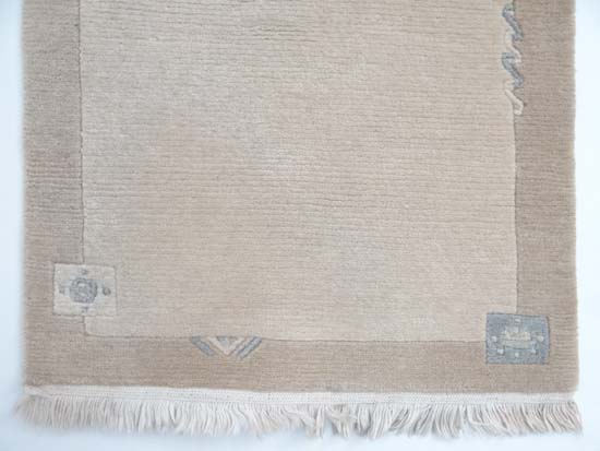 Carpet / Rug : a Woollen Rug in beige with a tan border with fringe to ends 
Approximately 41 1/2 - Image 4 of 13