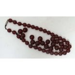 Vintage beads : A string of cherry amber Bakelite style beads, together with a quantity of loose