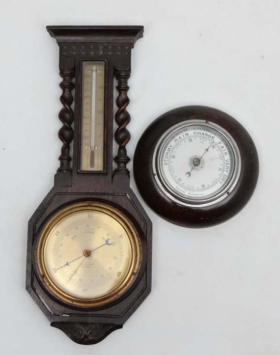 Aneroid Barometers ; an oak cased Dolland barometer with alcohol thermometer , barleytwist columns