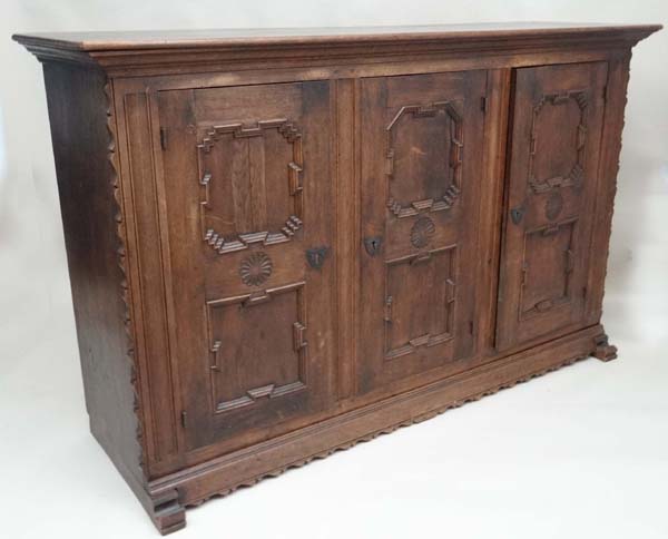 An early 20thC German oak 3 door cupboard with geometric like framed panelling, the doors opening to - Image 12 of 20