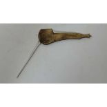 A brass covered folding pipe cleaner in the form of a pipe 3 1/2" long  CONDITION: Please Note -  we