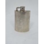 A silver plate hip flask of shaped form with engraved decoration . 4" high  CONDITION: Please Note -