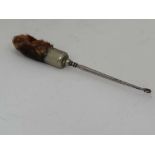 Taxidermy : an unusual silver plate mounted fox paw (dark) made into a button hook 8 1/2" long