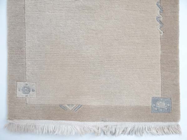 Carpet / Rug : a Woollen Rug in beige with a tan border with fringe to ends 
Approximately 41 1/2 - Image 5 of 13