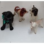 4 assorted ceramic dog figures
 CONDITION: Please Note -  we do not make reference to the