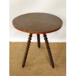 A 19thC Gypsy style table with walnut stained pine circular top and 3 walnut bobbin turned legs 21