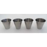 A cased set of 4 stainless steel beakers contained within a leather case 3 1/2" high  CONDITION: