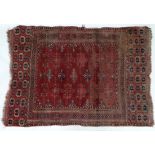 Carpet / rug : an antique Nomadic rug with wine ground , black , orange and salmon pink colours ,
