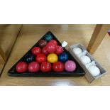 Snooker : A set of composite Snooker balls , comprising 16 reds , green , brown , yellow , blue ,