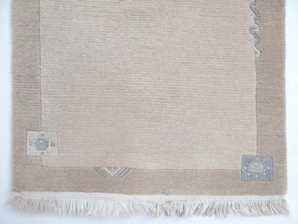 Carpet / Rug : a Woollen Rug in beige with a tan border with fringe to ends 
Approximately 41 1/2 - Image 9 of 14