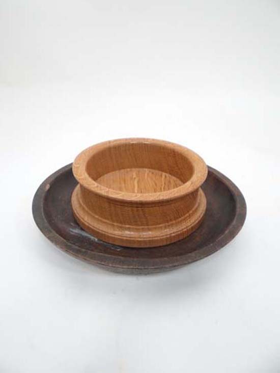 A wooden coaster and wooden bowl (2) CONDITION: Please Note -  we do not make reference to the