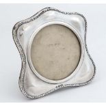 A silver photograph frame with circular glazed section and easel back. To fit photo  3 3/4"