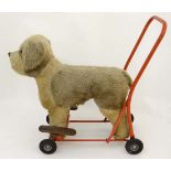 A 20th century plush push along and ride on dog. Made in Ireland by Lines Bros Ltd with stitched