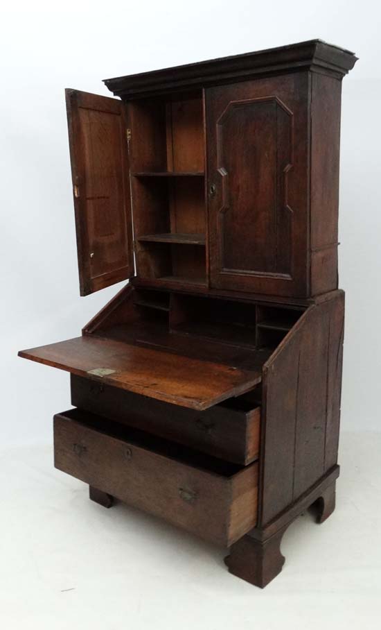 An 18thC George I country made oak bureau bookcase with hinged well section. 37" wide x 71" high x - Image 7 of 7