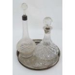 A cut glass ships decanter and stopper with silver rim. Hallmarked Birmingham 1972 maker Charles S