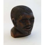 A carved wooden bust of a African male 4 3/4" high  CONDITION: Please Note -  we do not make