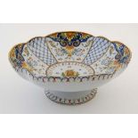 A French Faience style '' St Malo '' armorial tazza, having stylised floral and foliate decoration