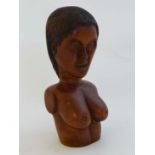 A carved wooden bust of a female tribal figure . Approx 8 1/2" high  CONDITION: Please Note -  we do